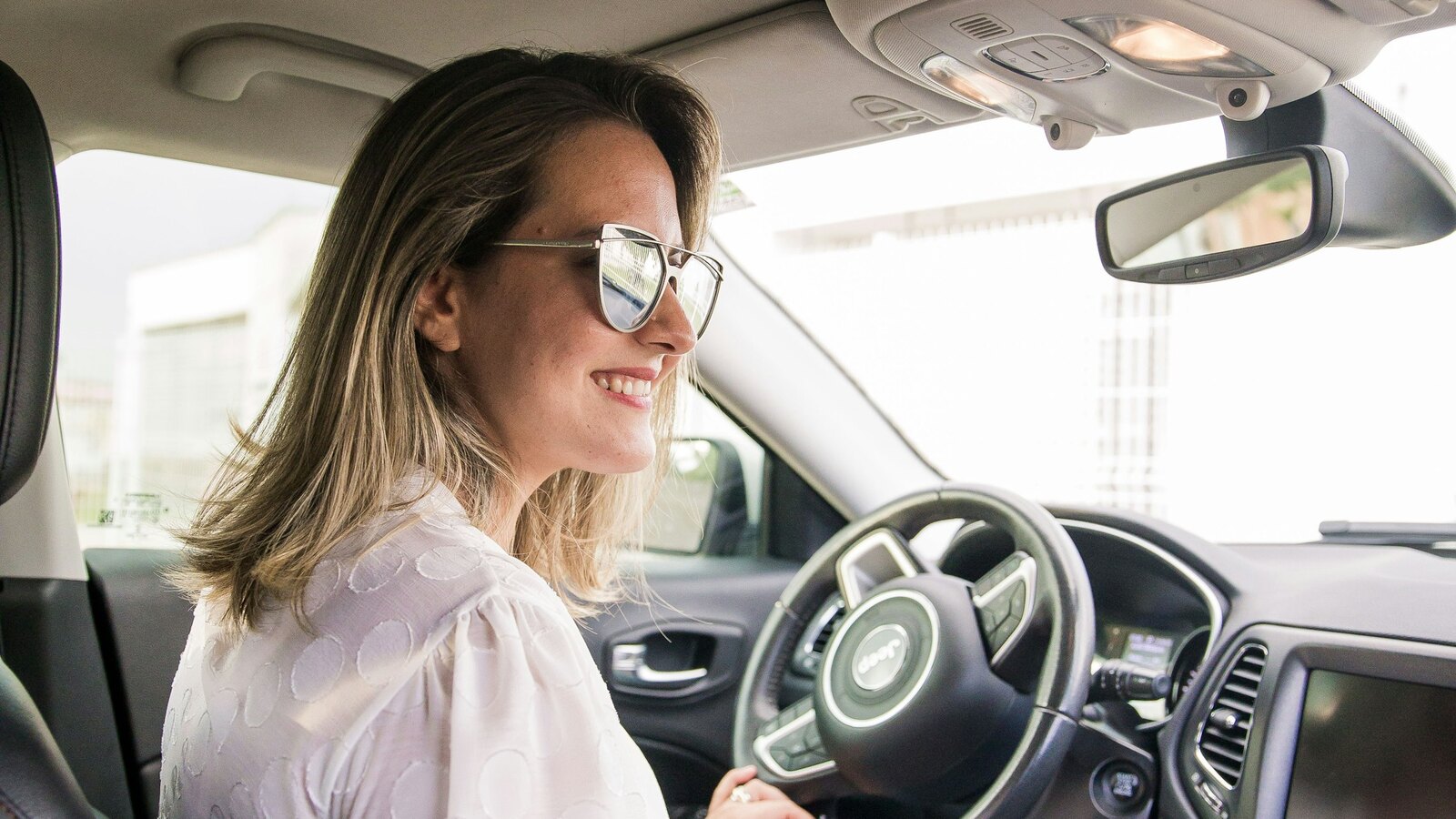 A First Gear instructor teaching a learner in the car